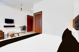 TV a/nebo společenská místnost v ubytování Hotel O ADVENT HOTEL