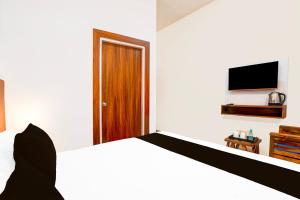TV a/nebo společenská místnost v ubytování Hotel O ADVENT HOTEL