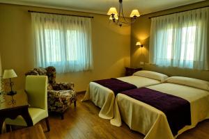 A bed or beds in a room at Posada Valle del Oso