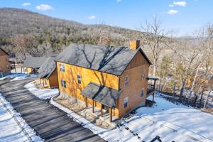 an aerial view of a house in the snow at All New Cabin w Free Attraction Tickets-Pvt Hot Tub-Community Indoor Pool in Hollister