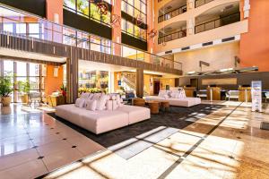 Resort pé na areia - Suítes JBVTOP的休息区