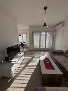Posezení v ubytování DL Apartment