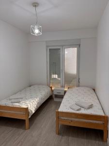 Postel nebo postele na pokoji v ubytování DL Apartment