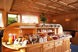 a kitchen with a bunch of food on a counter at Pension Golser in Cermes