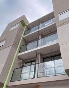 a building with a water hose attached to it at OH! Bahia Depto con cochera FREE in Bahía Blanca