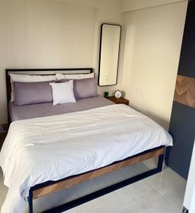 a bedroom with a large bed with a mirror at Your Ultimate Edge Awaits! in Thane