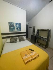 Ένα ή περισσότερα κρεβάτια σε δωμάτιο στο Recanto da Praia Rasa