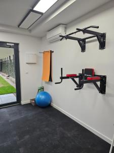 a gym with two treadmills and a gym ball at Apartament Przy Parkowej w centrum Niechorza blisko plaży in Niechorze