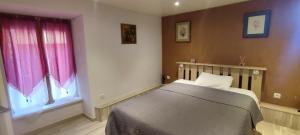 Ένα ή περισσότερα κρεβάτια σε δωμάτιο στο La maison du pêcheur