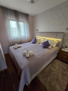 Posteľ alebo postele v izbe v ubytovaní Apartments Luana with private jacuzzi