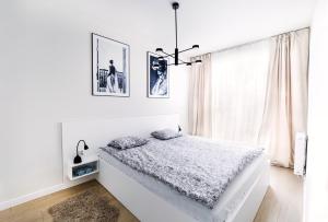 Posteľ alebo postele v izbe v ubytovaní ONE Apartament WROCŁAW