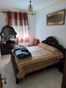 Ένα ή περισσότερα κρεβάτια σε δωμάτιο στο Noor Home