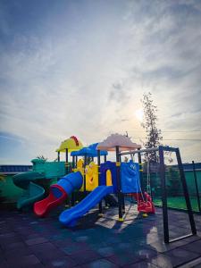 a playground with a slide and a slideintend at Gabala Bless Hotel Cottage in Gabala
