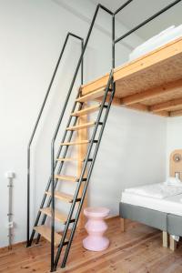 Postel nebo postele na pokoji v ubytování Flattering Suites