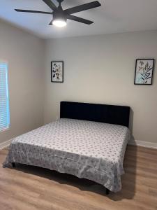 a bedroom with a bed and a ceiling fan at New home near beautiful beaches in Port Charlotte