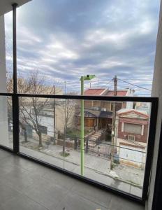 a large window with a view of a building at OH! Bahia Depto con cochera FREE in Bahía Blanca