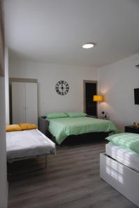 Ένα ή περισσότερα κρεβάτια σε δωμάτιο στο Manipura Home