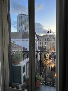 a view of a city from a window at Nova21 in Naples