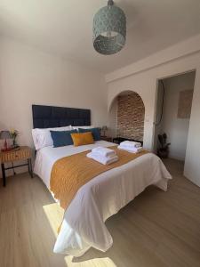 En eller flere senge i et værelse på Apartamento Anita Ronda