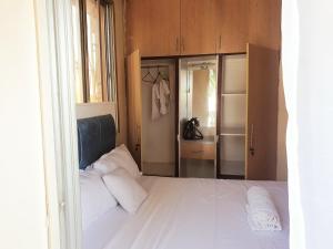 Ένα ή περισσότερα κρεβάτια σε δωμάτιο στο Haven Homes +2 φωτογραφίες