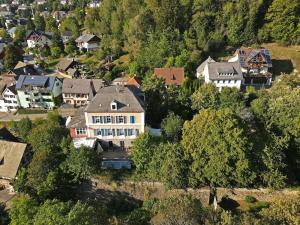 an aerial view of a town with houses and trees at theMAP in Lenzkirch