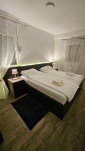 Postel nebo postele na pokoji v ubytování Silver Dream 2