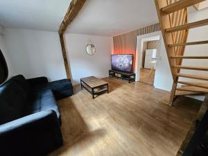 a living room with a couch and a table at Maison à louer in Insming
