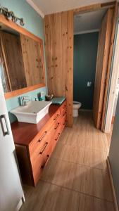 a bathroom with a sink and a toilet at casa del barco 1 in Pichilemu