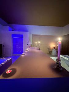 a room with a long table with candles on it at PINK ROOm in Tourcoing