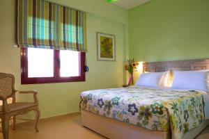 Postel nebo postele na pokoji v ubytování Exanthia Villas