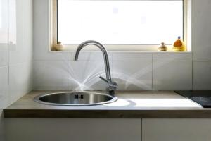 a sink in a kitchen with a window at Appartement Quartier les Presidents - 2-4 personnes in La Rudelière +14 photos