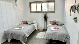 Postel nebo postele na pokoji v ubytování Nest on the beach Resort Apart