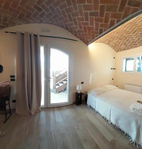 Postel nebo postele na pokoji v ubytování B&B Casa Pascolone