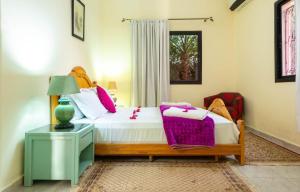 Postel nebo postele na pokoji v ubytování Qodwa Palace Riad & SPA