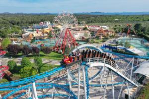 an amusement park with a roller coaster and a ferris wheel at Ventura mobile home in Biograd na Moru