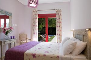Postel nebo postele na pokoji v ubytování Exanthia Villas