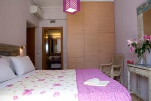 Postel nebo postele na pokoji v ubytování Exanthia Villas