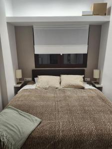 En eller flere senge i et værelse på NIEVELUXURY sierra nevada