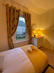 Katil atau katil-katil dalam bilik di Beadles Cottage Lux Family Haven