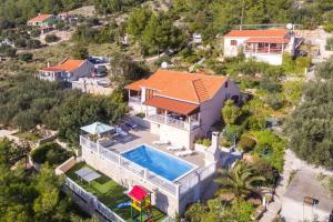 an aerial view of a house with a swimming pool at House Vila Petra in Blato