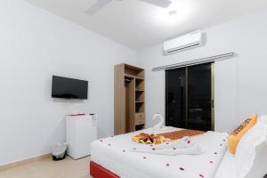 a bedroom with a bed with a pair of shoes on it at Old town apartment 2 in Aqaba