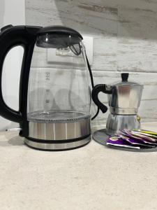 a coffee maker sitting on top of a counter at Casa nel vicolo in Montichiari +8 photos