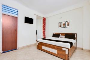 Postel nebo postele na pokoji v ubytování HOTEL O RAJ STAY