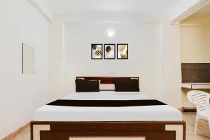 Postel nebo postele na pokoji v ubytování HOTEL O RAJ STAY