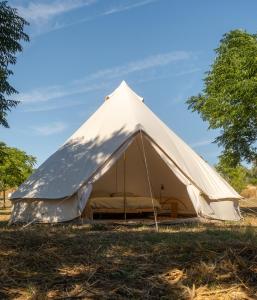 a large bell tent on a grass field at Nomad Pop-Up Hotel Aljezur in Aljezur