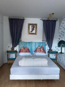 Rúm í herbergi á BnB122 bed&breakfast