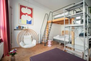 Postel nebo postele na pokoji v ubytování Flattering Suites