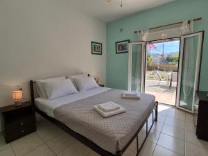 Ένα ή περισσότερα κρεβάτια σε δωμάτιο στο Palatinos I