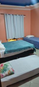 Ένα ή περισσότερα κρεβάτια σε δωμάτιο στο Baixo Sana pousada +44 φωτογραφίες