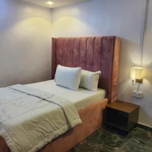 Ένα ή περισσότερα κρεβάτια σε δωμάτιο στο WELTONS Apartment BABA YUSUF